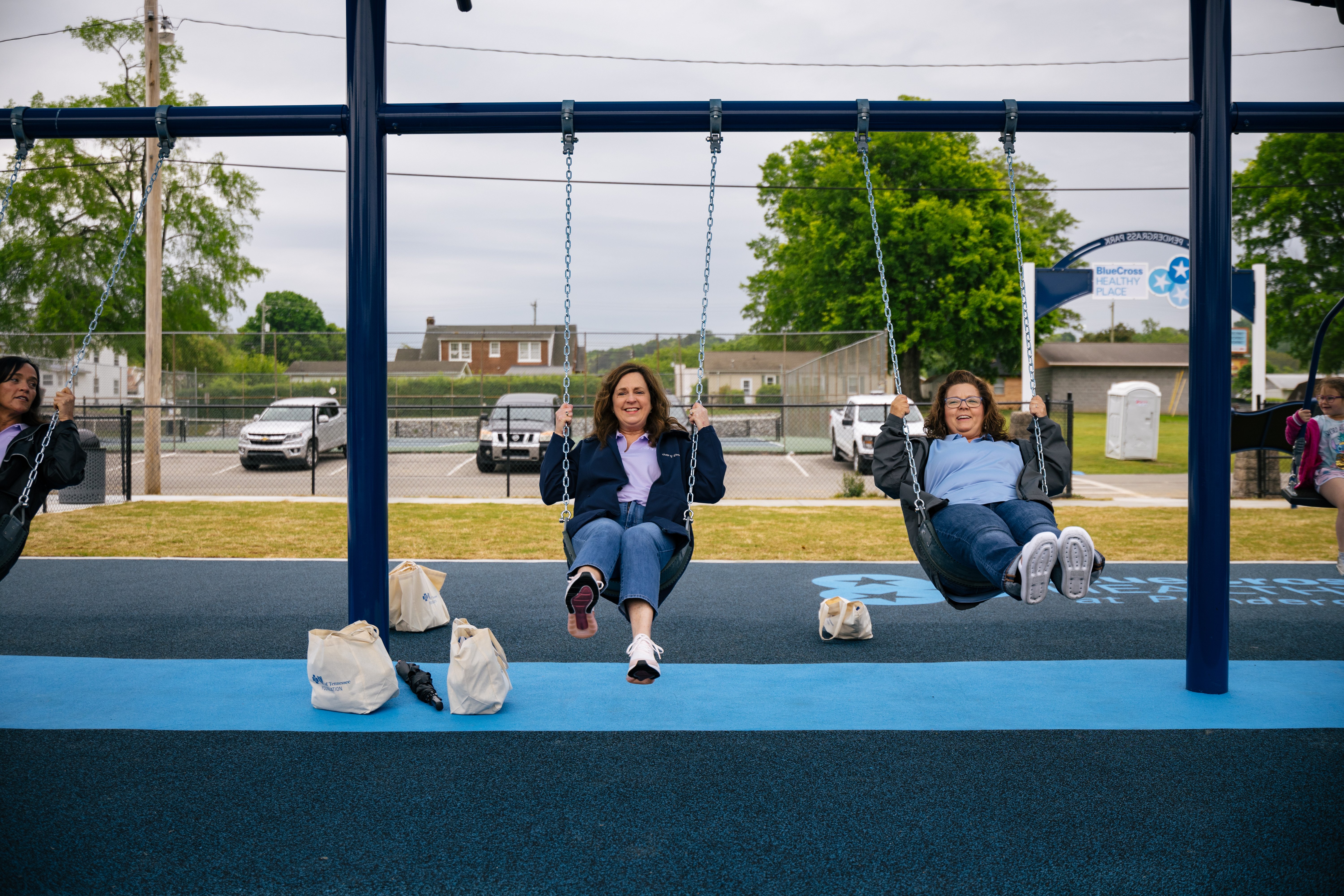 Women on swings at Pendergrass Park in Dayton, TN