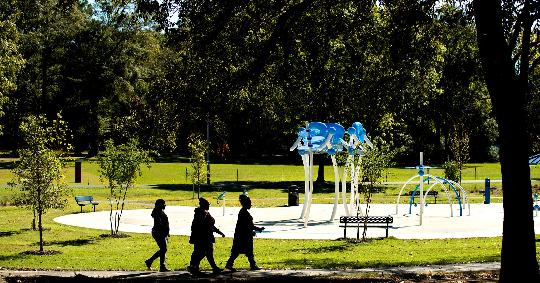 women walking on trail at IMPACT Parks waterpark