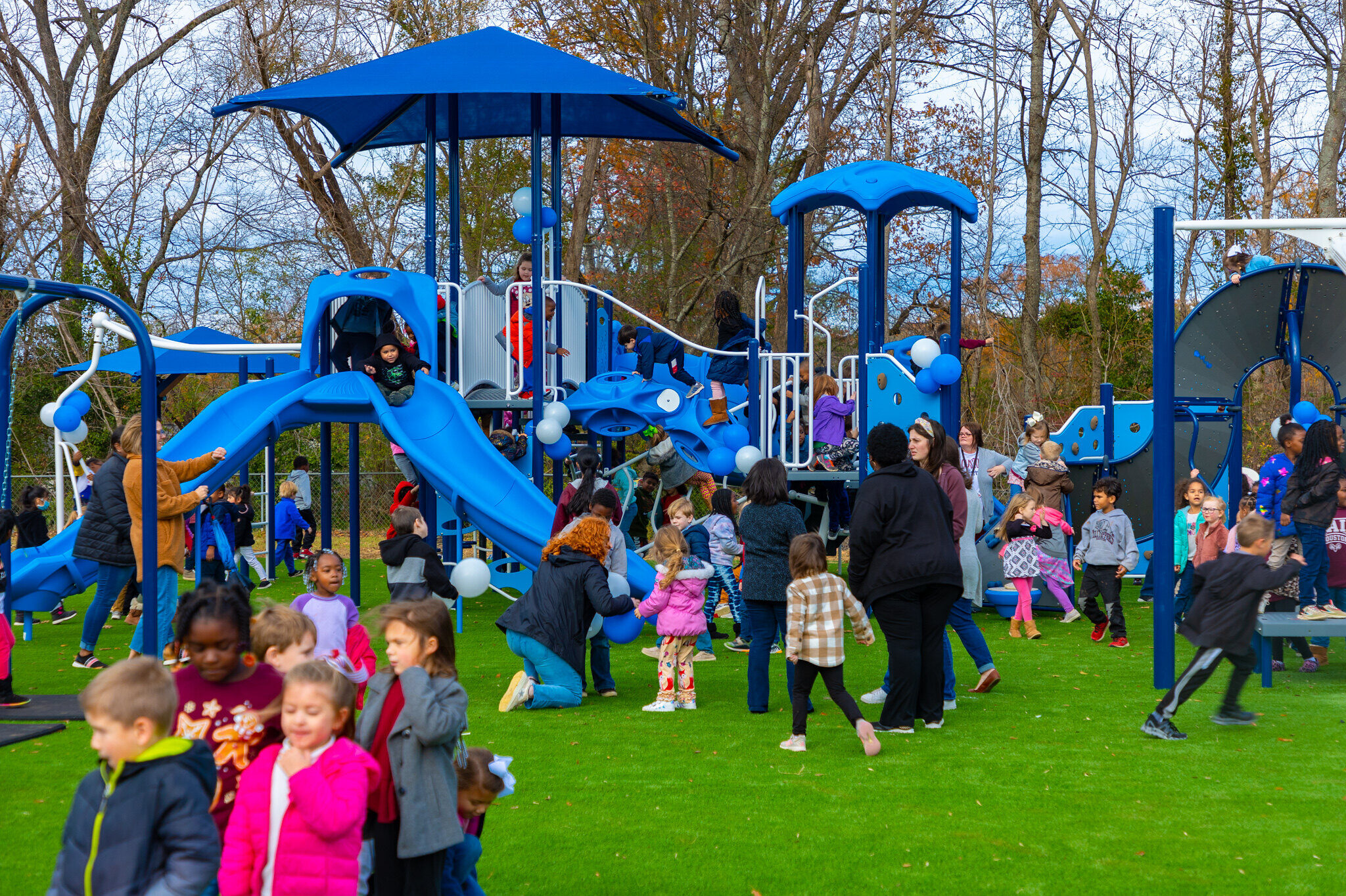 Community members enjoying IMPACT Parks playground